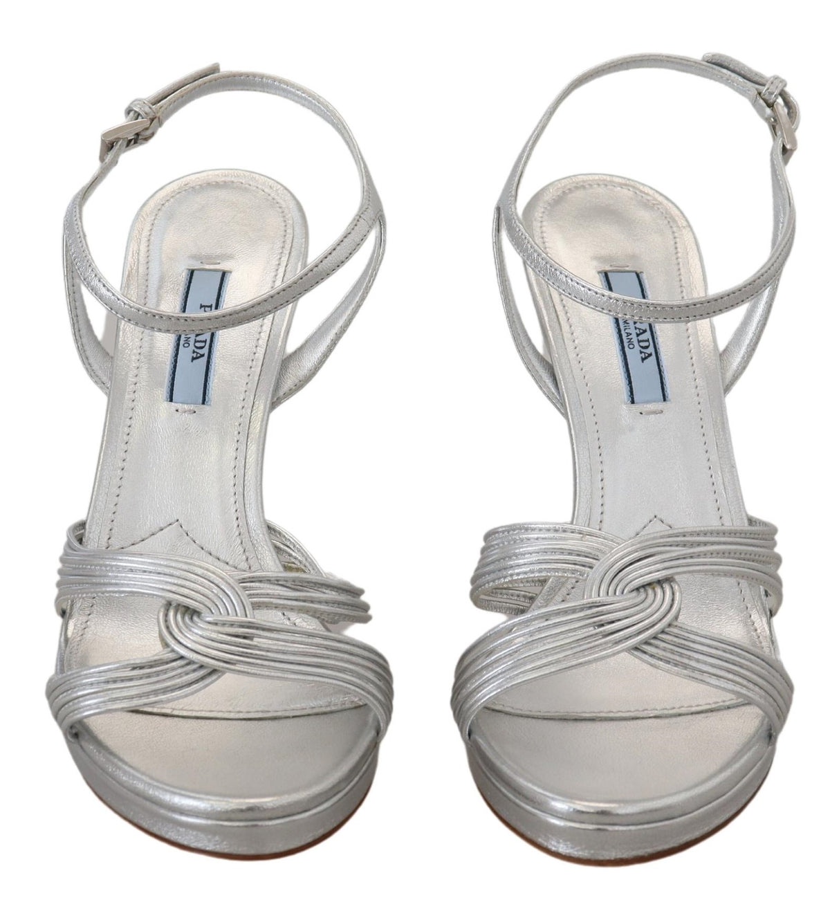 Step into unparalleled elegance with Prada Silver Leather Sandals, crafted in Italy from premium leather, embodying timeless luxury for the discerning individual.