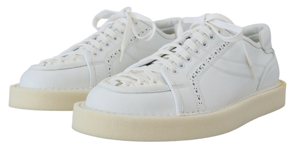 Indulge in the exquisite Dolce & Gabbana White Leather Low Top Oxford Sneakers, crafted from 100% genuine leather in Italy, merging timeless elegance with unparalleled comfort for the discerning individual.