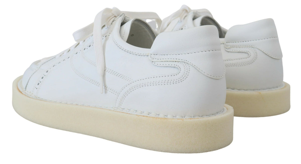 Elevate your style with Dolce & Gabbana's White Leather Low Top Oxford Sneakers, crafted in Italy from premium leather, embodying timeless elegance and luxurious comfort.