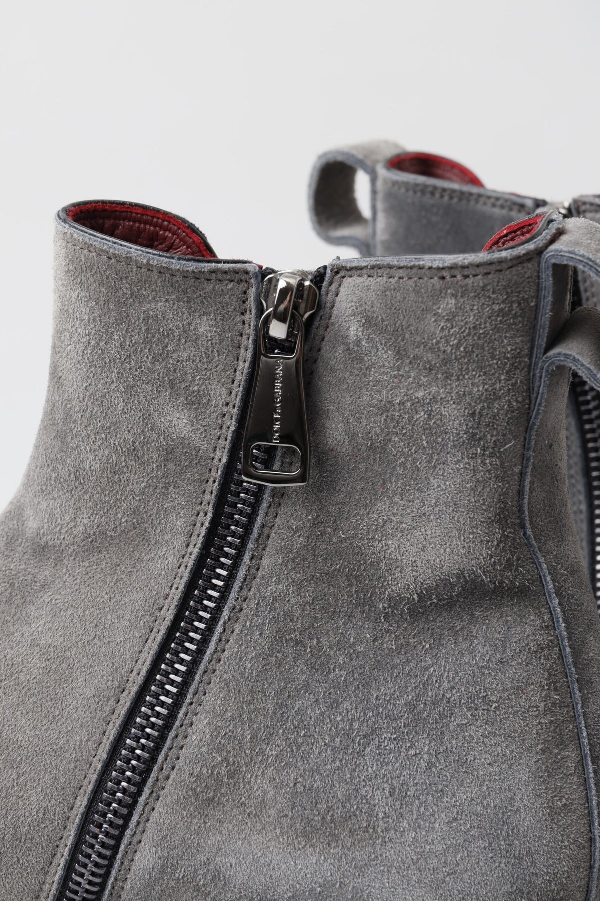 Elevate your style with Dolce & Gabbana Gray Leather Ankle Boots, handcrafted in Italy from luxurious leather, embodying timeless elegance and sophisticated allure.
