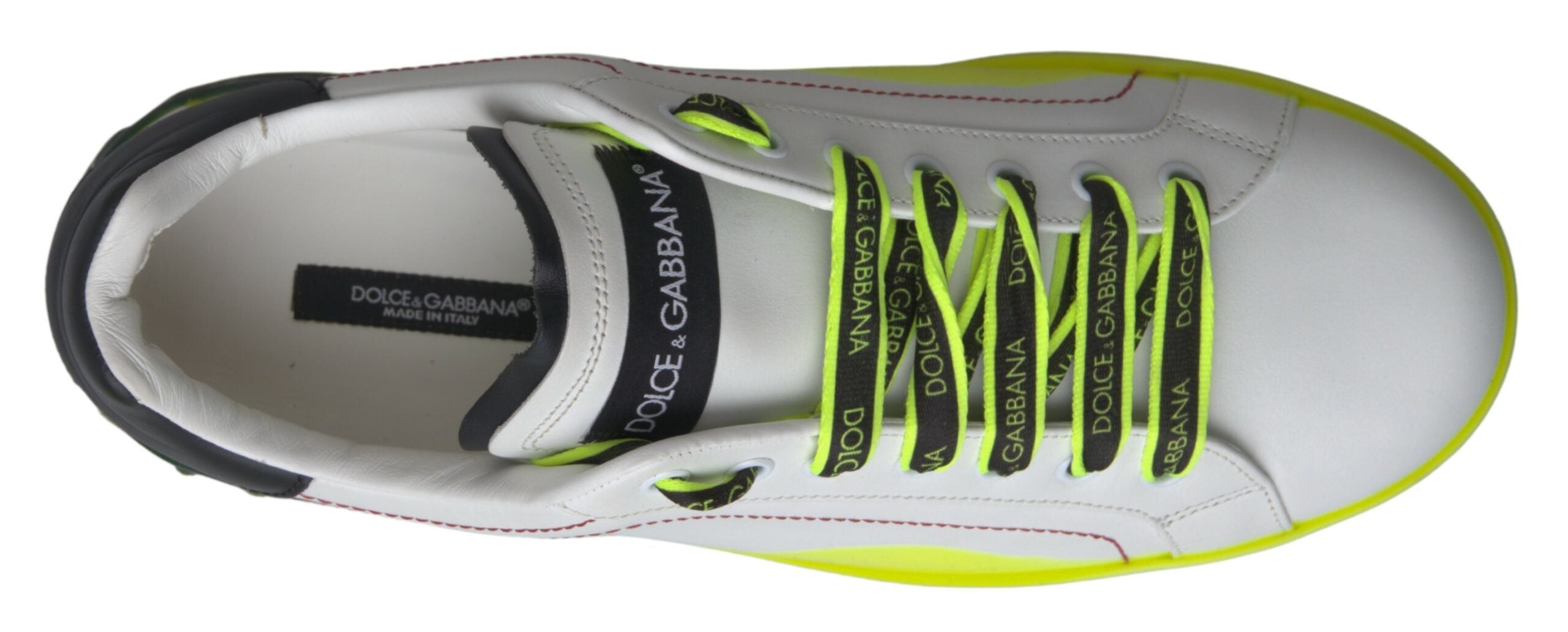 Indulge in the exquisite Dolce & Gabbana White Yellow Portofino Leather Sneakers, where premium leather meets iconic design, embodying luxury and sophistication for the discerning individual.