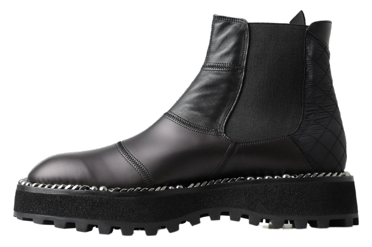 Step into sophistication with Dolce & Gabbana's Black Leather Slip on Stretch Boots, a luxurious blend of artisanal craftsmanship and timeless elegance, perfect for the discerning individual.