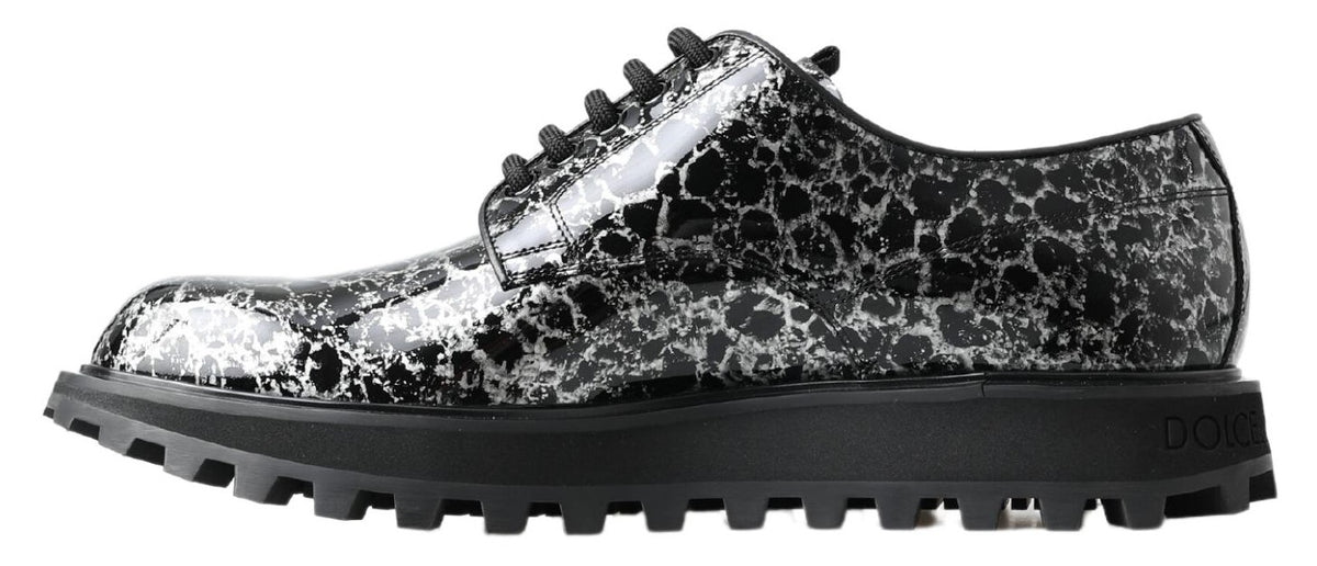 Step into elegance with Dolce & Gabbana's Black White Derby Patent Leather Shoes, where Italian craftsmanship meets luxurious design for the discerning connoisseur.