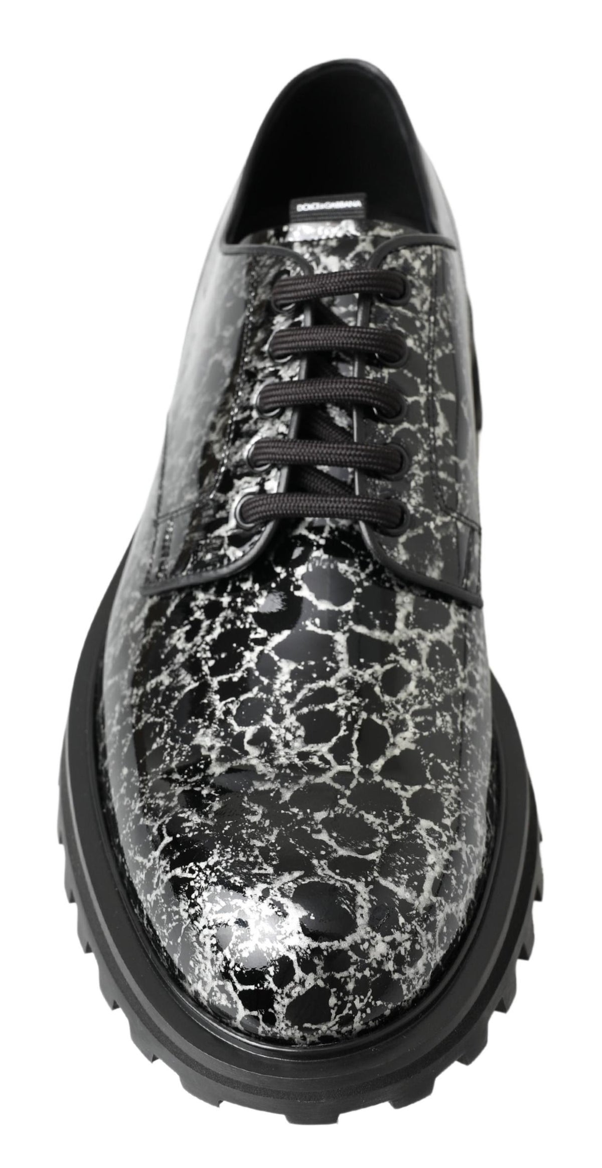 Step into elegance with Dolce & Gabbana's Black White Derby Patent Leather Shoes, where exquisite Italian craftsmanship meets luxurious design, perfect for the discerning individual.