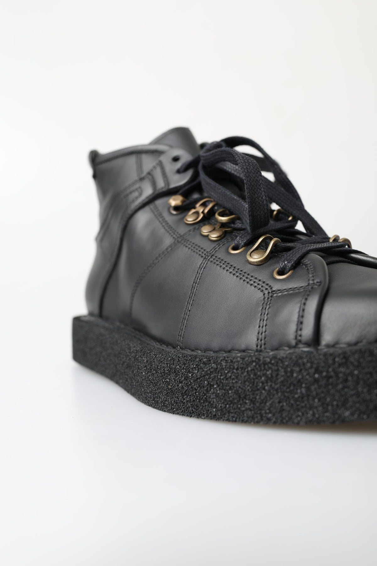 Step into elegance with Dolce & Gabbana's Black Leather Slip-on Stretch Boots, handcrafted in Italy for the discerning individual who embodies luxury and sophistication.
