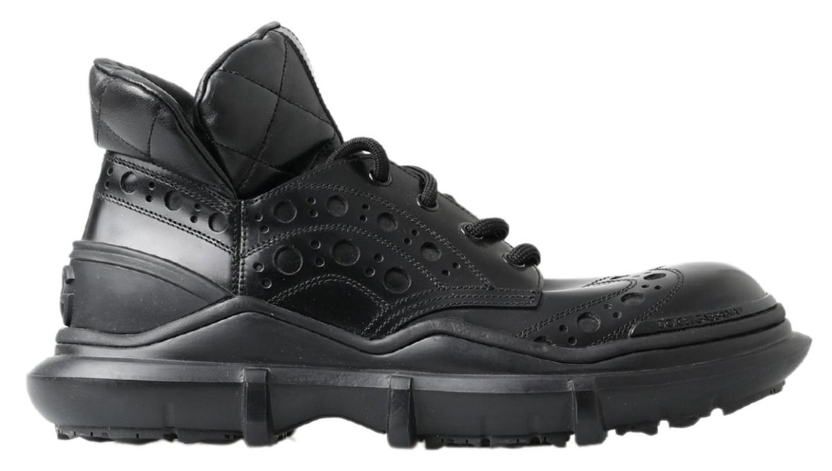 Step into the realm of elegance with Dolce & Gabbana's Black Leather Ankle Casual Boots, where Italian craftsmanship meets timeless sophistication for the discerning individual.