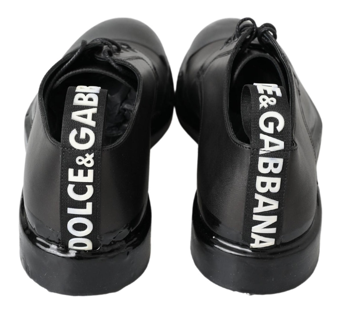 Experience the exquisite craftsmanship of Dolce & Gabbana's Black Leather Derby Dress Shoes, where timeless luxury meets modern sophistication for the discerning individual.