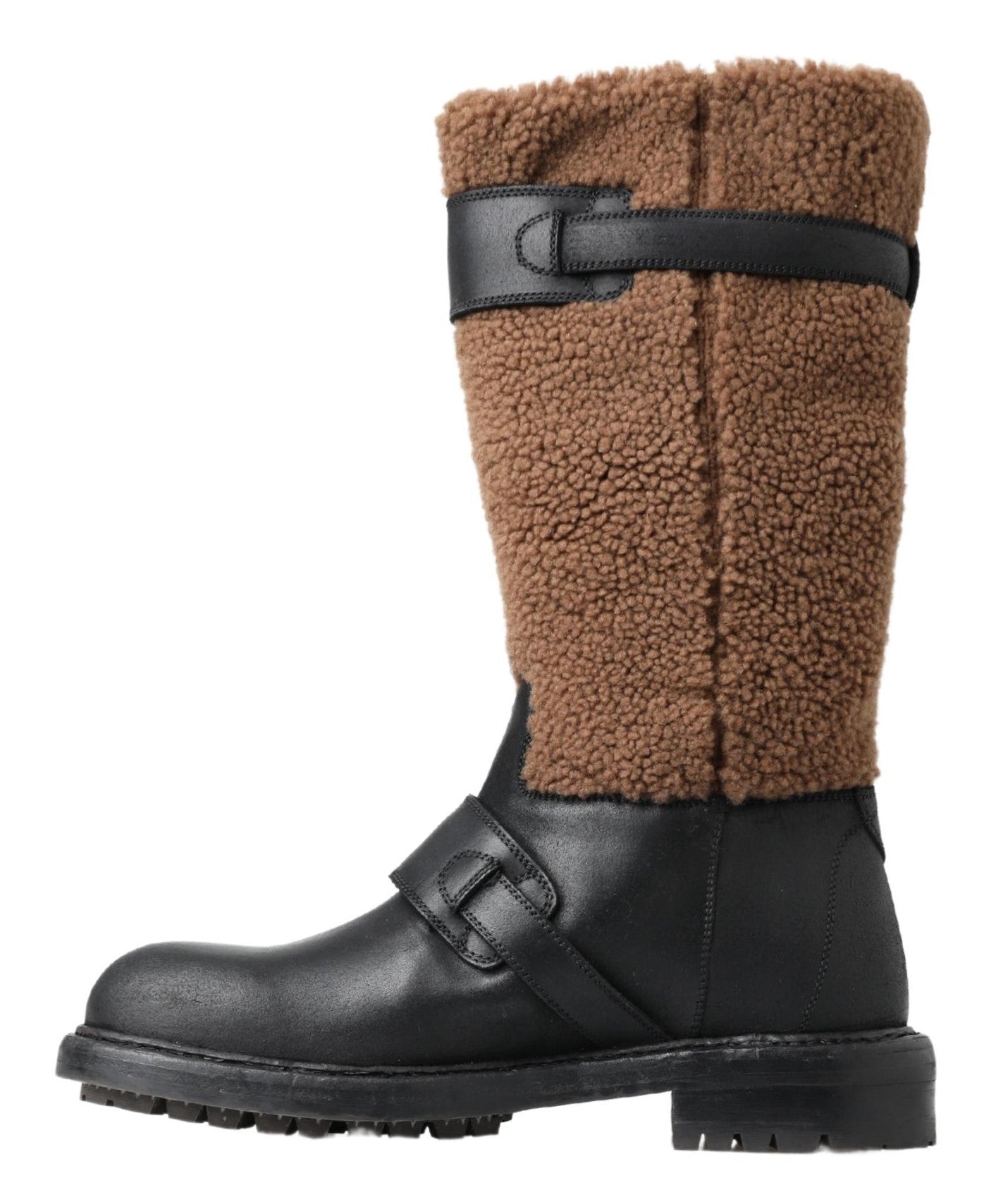 Indulge in the exquisite Dolce & Gabbana Black Leather Brown Shearling Boots, where luxurious craftsmanship meets timeless elegance for the discerning individual.
