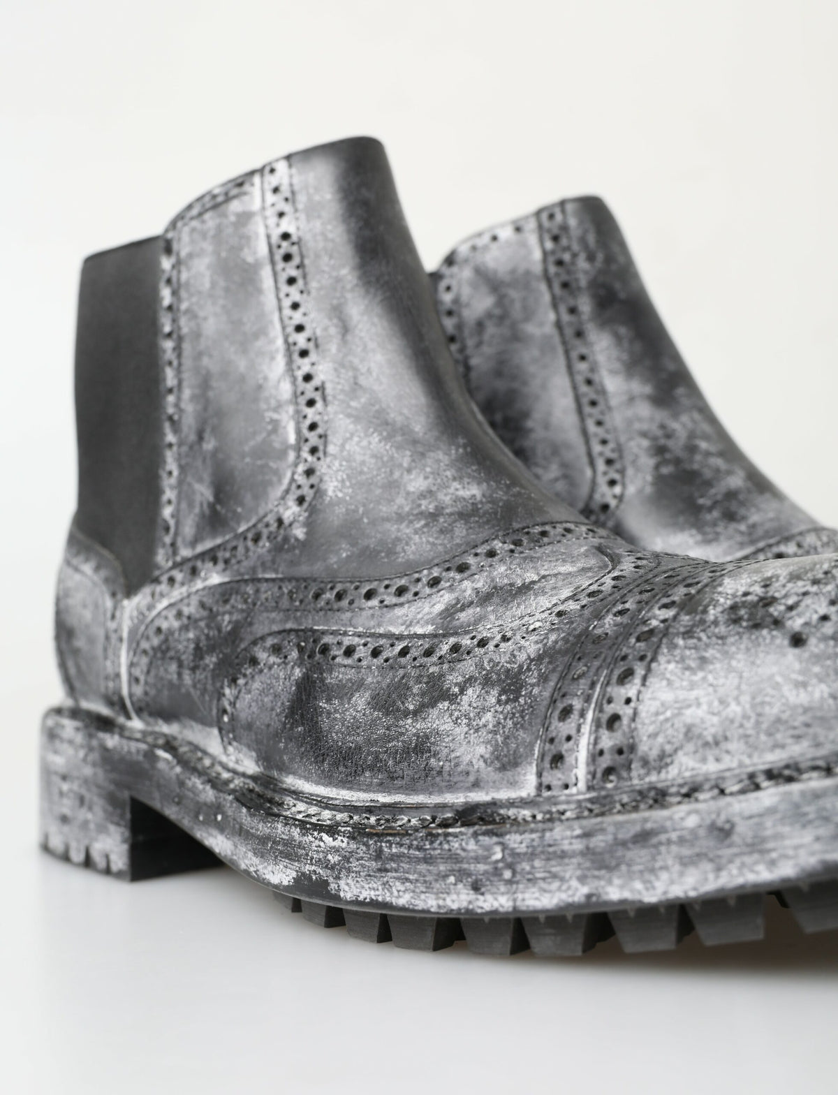 Step into a world of elegance with Dolce & Gabbana Black Gray Leather Ankle Boots, crafted from premium materials for the discerning individual who commands attention.