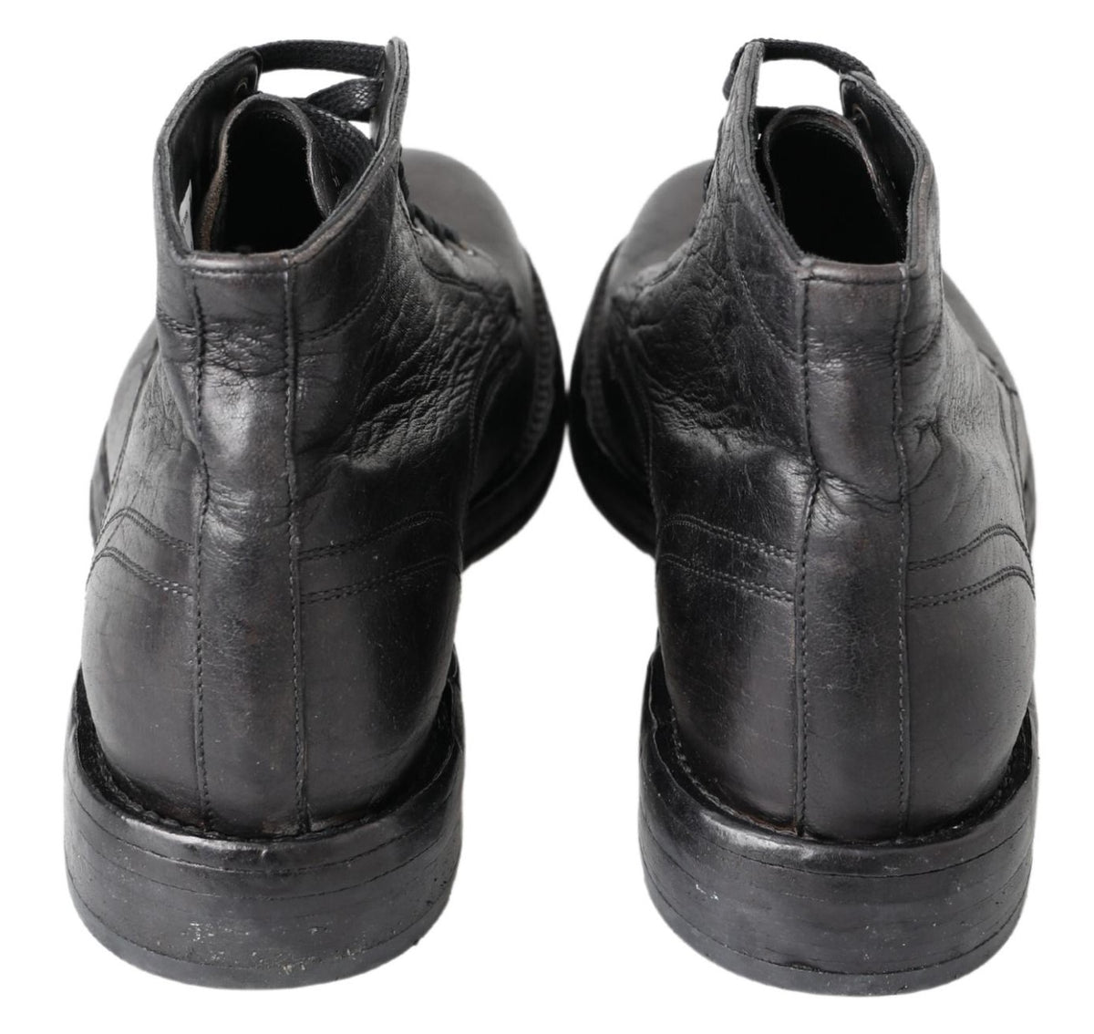 Indulge in the exquisite Dolce & Gabbana Black Horse Leather Perugino Boots, where Italian craftsmanship meets refined elegance, elevating your style with unmatched luxury.