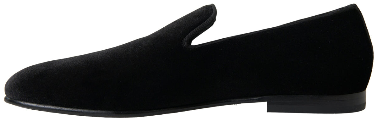 Step into elegance with Dolce & Gabbana Black Velvet Loafers, crafted from sumptuous velvet for timeless allure, perfect for sophisticated occasions.