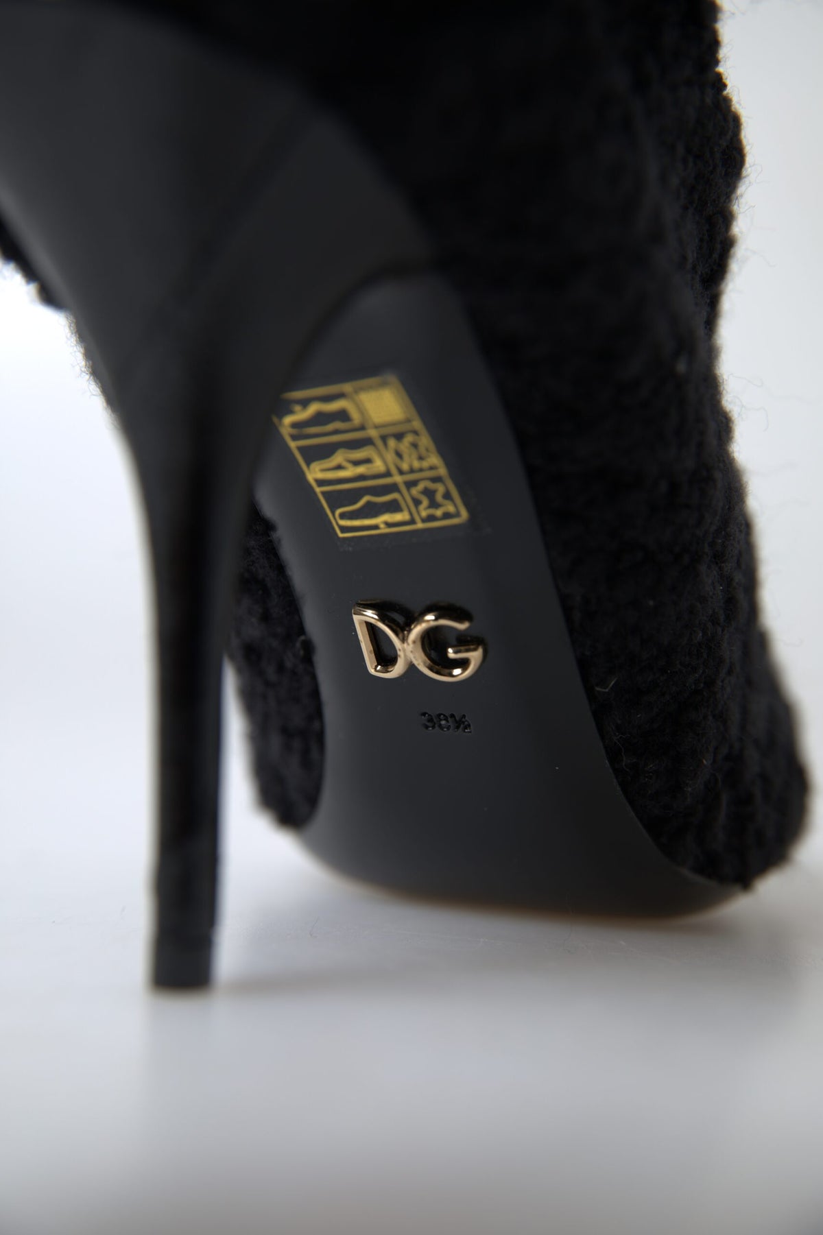 Indulge in the exquisite allure of Dolce & Gabbana Black Stiletto Heels Mid Calf Boots, crafted from premium virgin wool for timeless elegance and unparalleled sophistication.