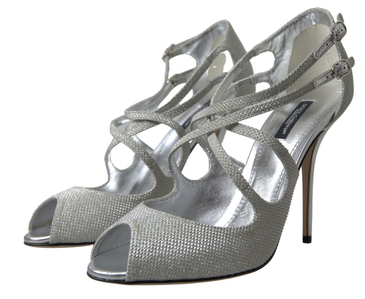 Step into unparalleled elegance with Dolce & Gabbana Silver Shimmers Sandals, where exquisite Italian craftsmanship and luxurious materials elevate your style to new heights.