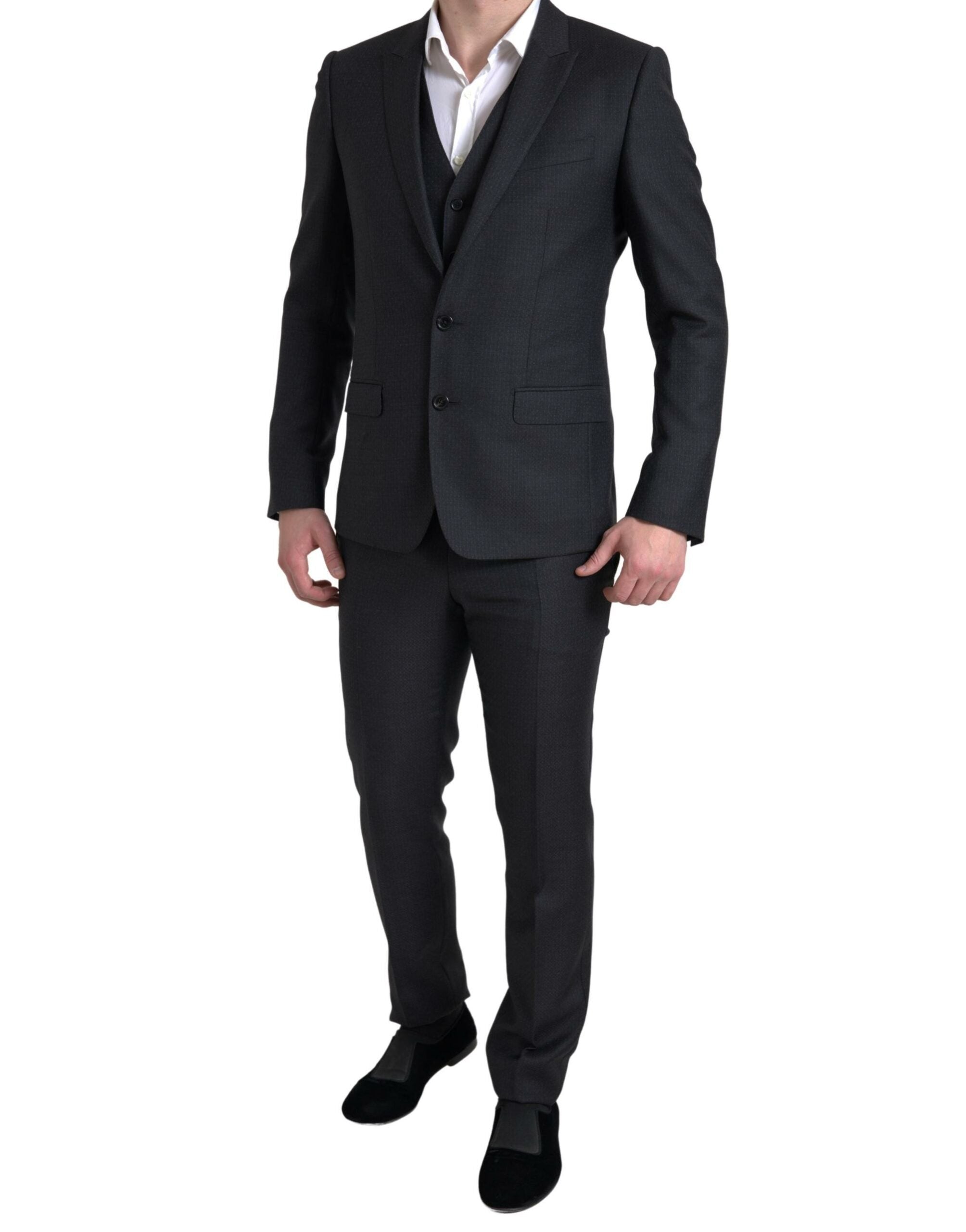 Elevate your wardrobe with the Dolce & Gabbana Black MARTINI Suit, crafted from luxurious virgin wool, embodying timeless elegance and exquisite Italian craftsmanship.