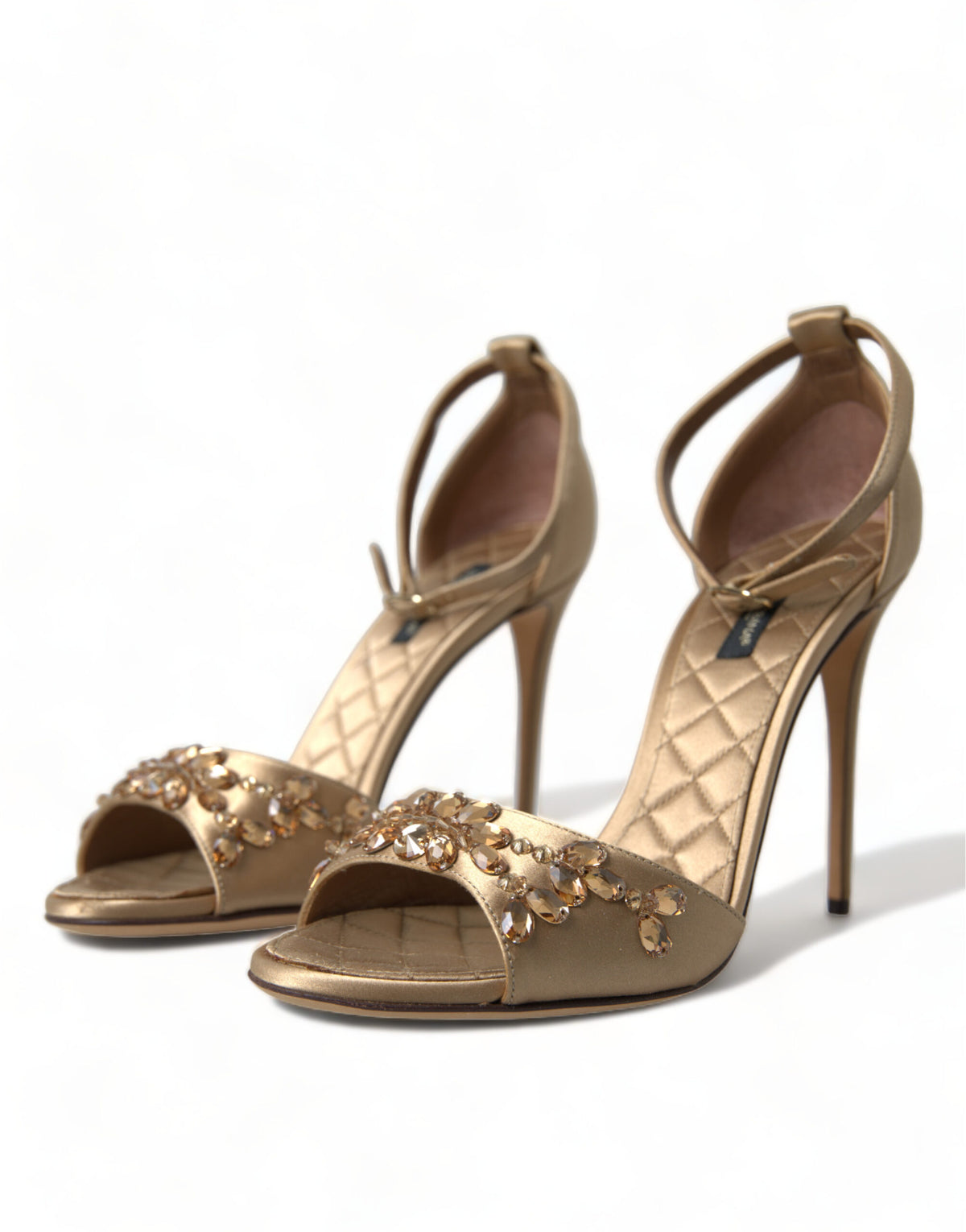 Elevate your elegance with Dolce & Gabbana's Gold Satin Ankle Strap Crystal Sandals, where exquisite craftsmanship meets opulent design for unforgettable moments.