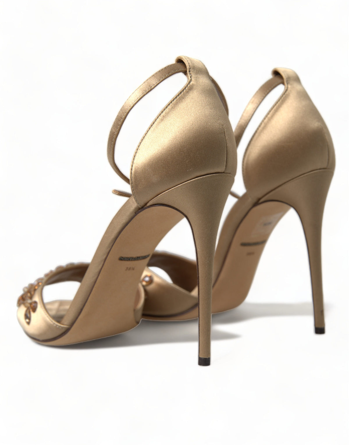 Indulge in the exquisite craftsmanship of Dolce & Gabbana's Gold Satin Ankle Strap Crystal Sandals, where luxurious silk and viscose meet timeless elegance for unforgettable moments.