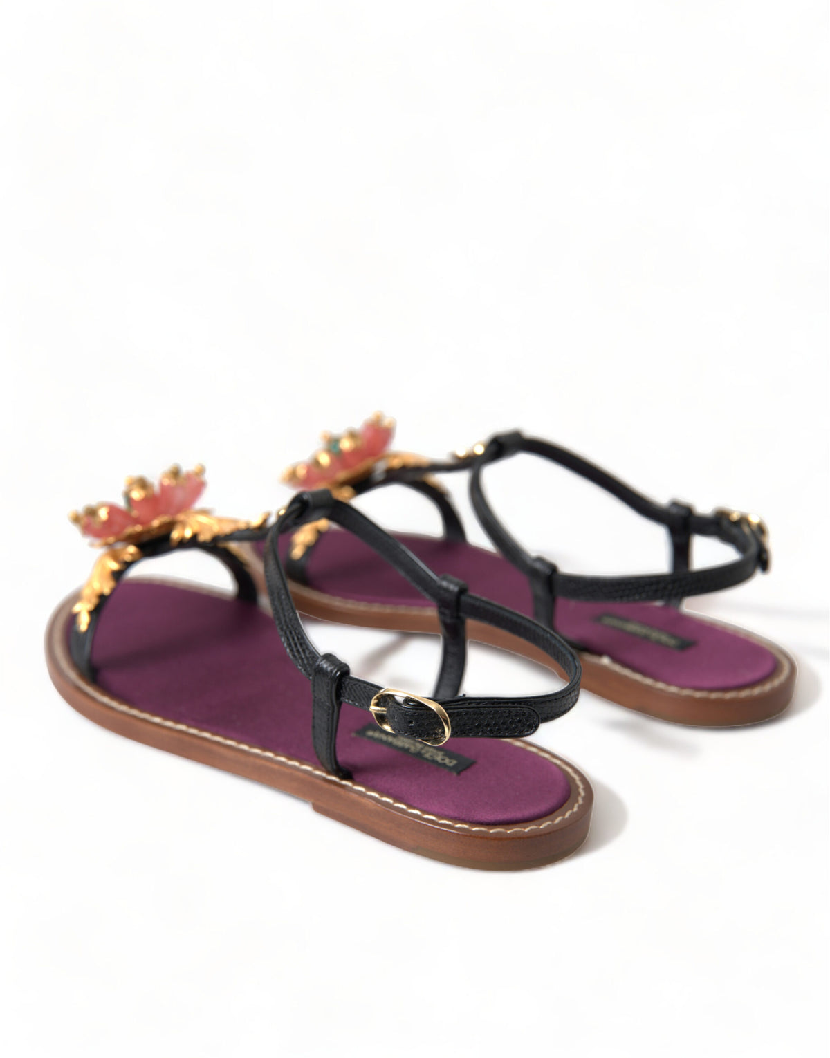 Indulge in the exquisite Dolce & Gabbana Black Crystal Gold Sandals, crafted from premium leather with intricate pink stone embellishments, embodying timeless luxury and sophistication.
