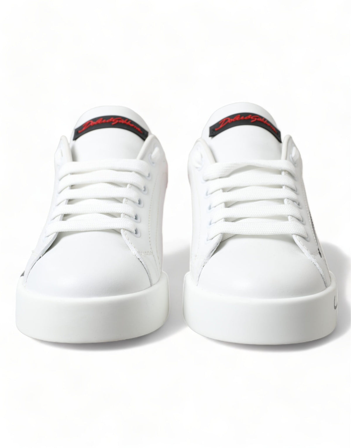 Step into the realm of luxury with Dolce & Gabbana's White Red Lace Up Women's Low Top Sneakers, crafted in Italy from sumptuous leather, embodying elegance and sophistication for the discerning individual.
