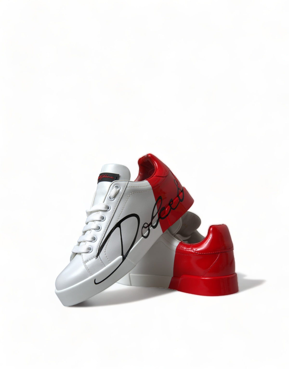 Step into the realm of luxury with Dolce & Gabbana's White Red Lace Up Women's Low Top Sneakers, crafted from sumptuous leather in Italy, embodying elegance and sophistication for the discerning individual.