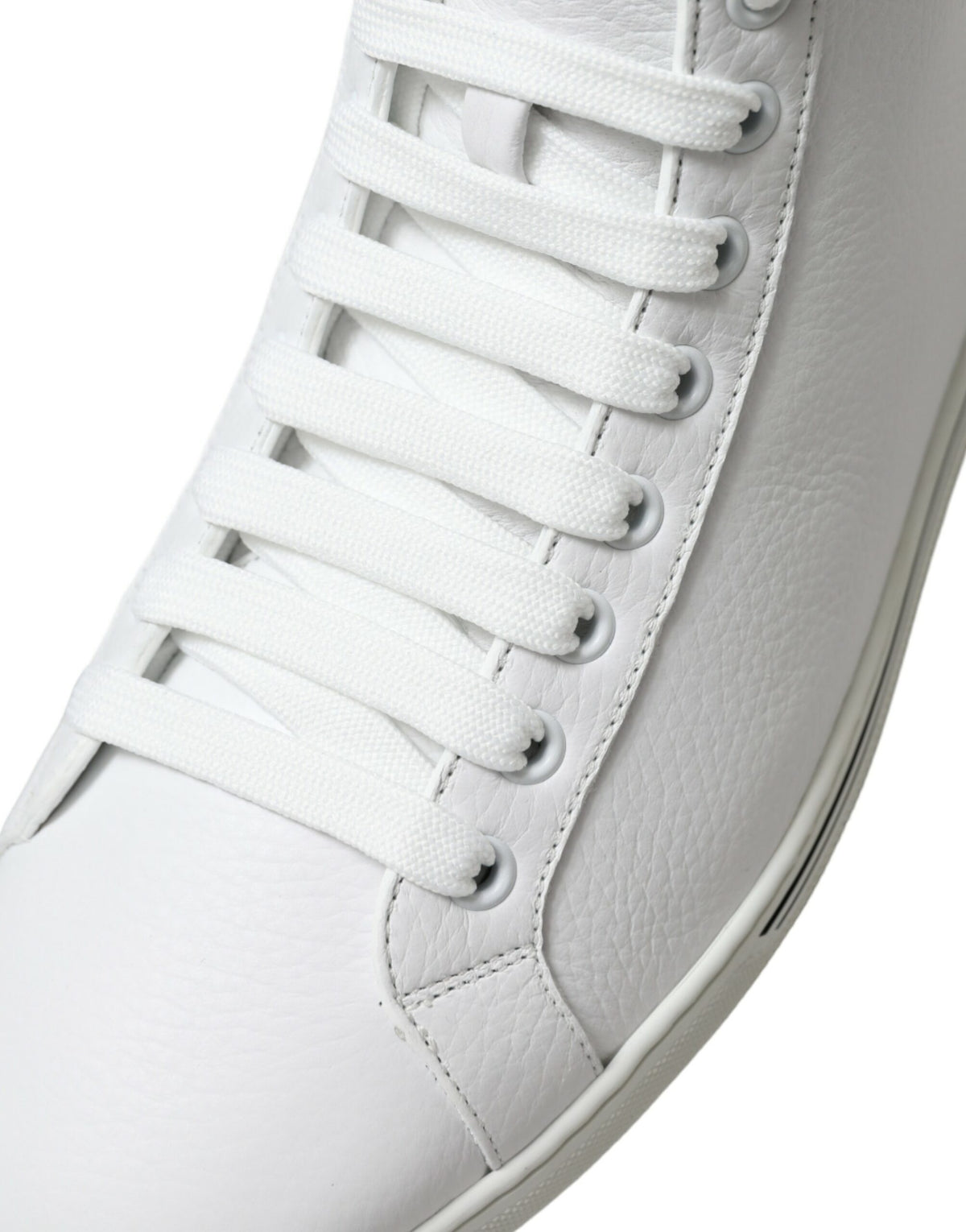 Elevate your style with Dolce & Gabbana's White Saint Tropez High Top Sneakers, crafted from premium leather, embodying timeless luxury and exquisite Italian artistry.