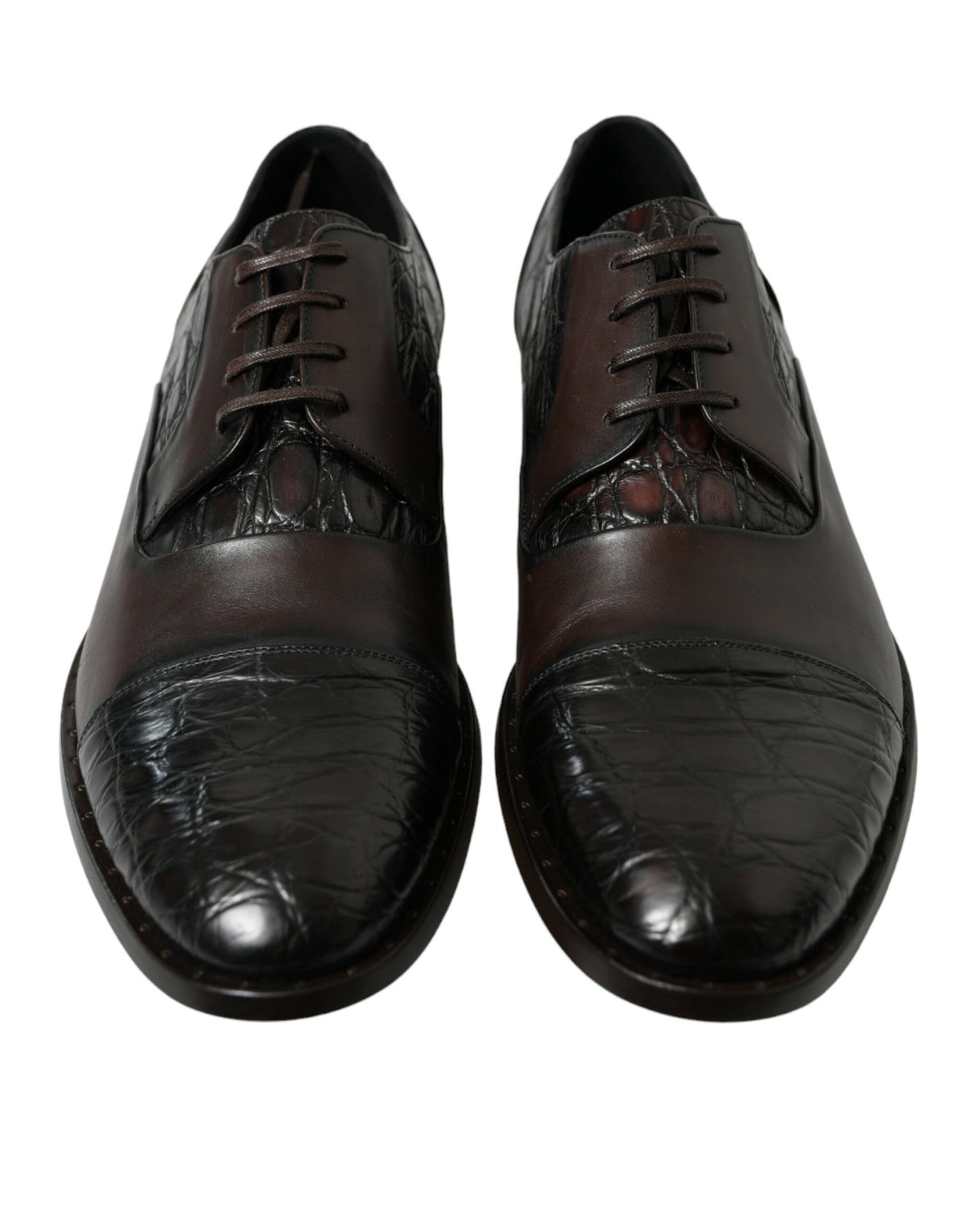 Indulge in the artisanal elegance of Dolce & Gabbana's Brown Exotic Leather Formal Dress Shoes, where exquisite Caiman and Calfskin craftsmanship meets timeless sophistication.