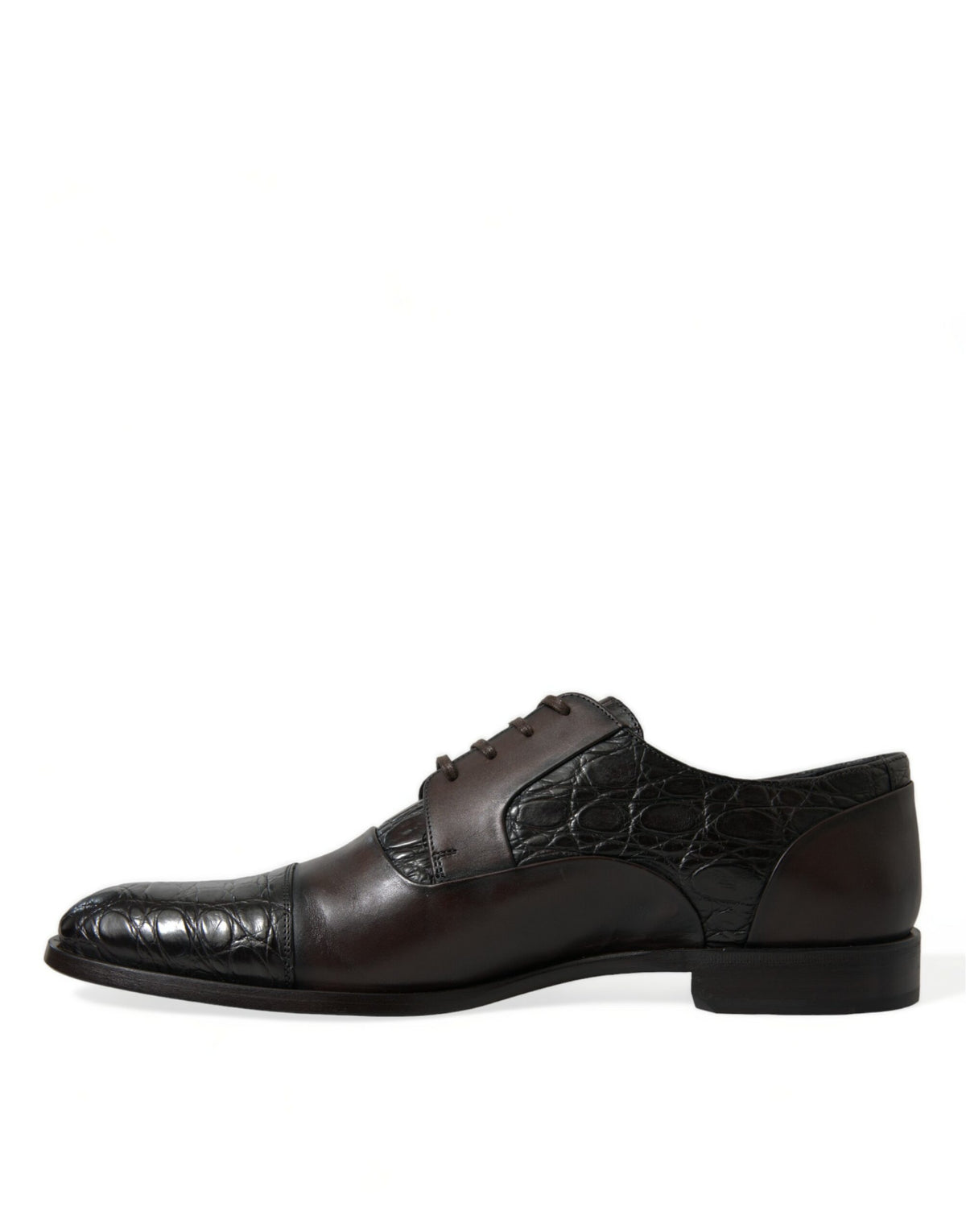 Indulge in the artisanal elegance of Dolce & Gabbana's Brown Exotic Leather Formal Men Dress Shoes, where exquisite Caiman and Calfskin craftsmanship meets timeless sophistication.