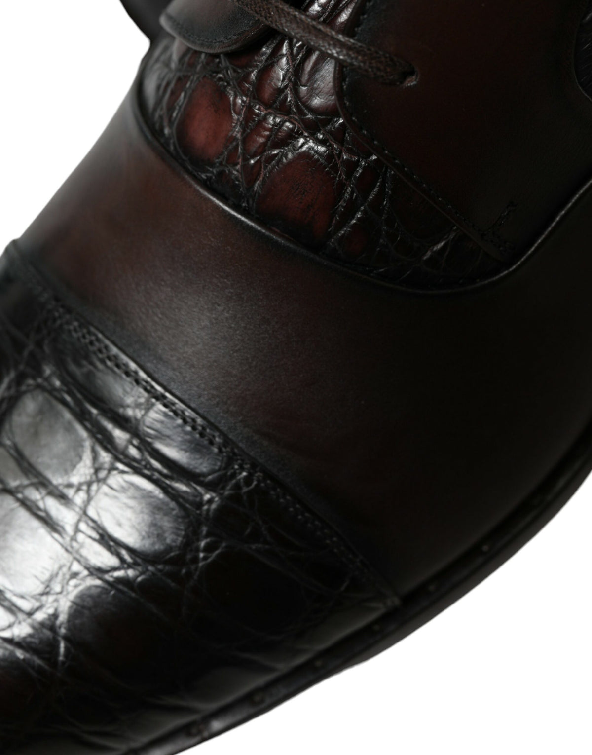 Indulge in the artisanal elegance of Dolce & Gabbana's Brown Exotic Leather Formal Dress Shoes, where exquisite Caiman and Calfskin craftsmanship elevates your style.