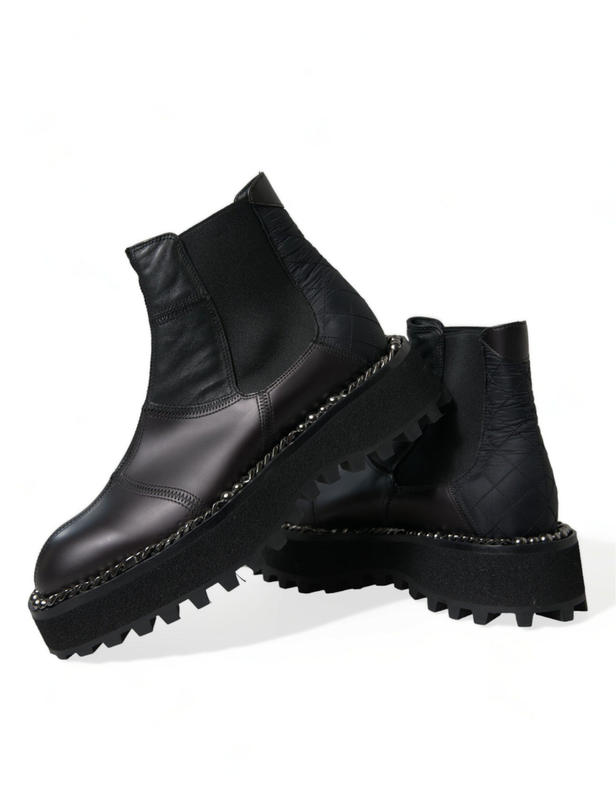 Step into elegance with Dolce & Gabbana's Black Leather Slip On Stretch Chelsea Boots, crafted in Italy for the discerning individual who embodies sophistication and style.