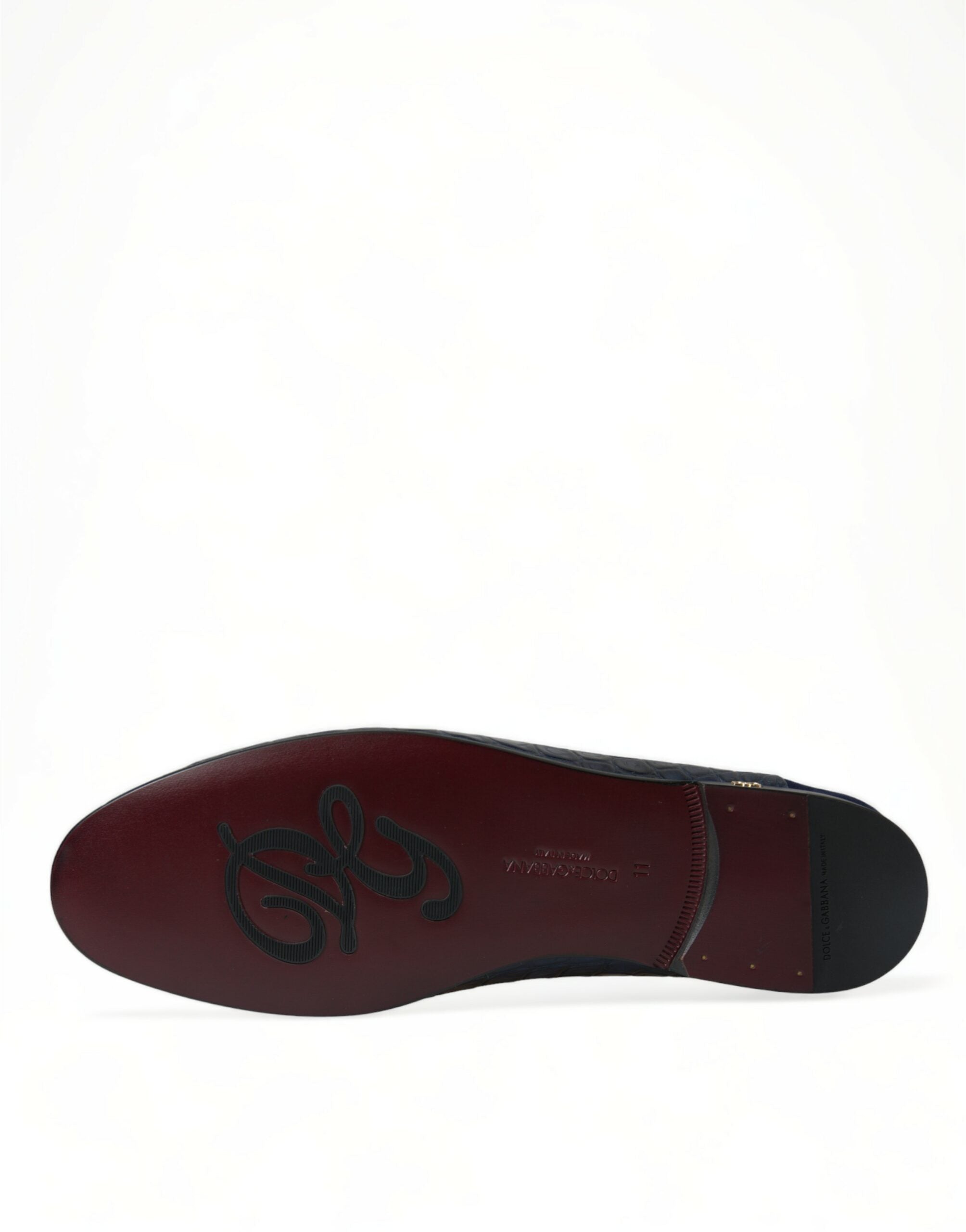 Indulge in the exquisite Dolce & Gabbana Blue Crocodile Leather Loafers, a luxurious blend of craftsmanship and style that elevates any wardrobe with timeless elegance.