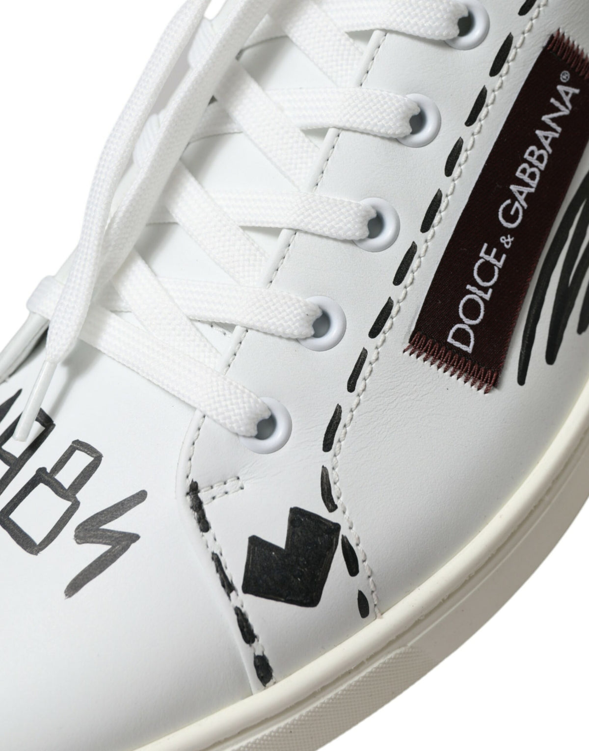Elevate your style with Dolce & Gabbana's White Bordeaux Leather Logo Low Top Sneakers, expertly crafted from luxurious calf leather for timeless elegance and unmatched comfort.