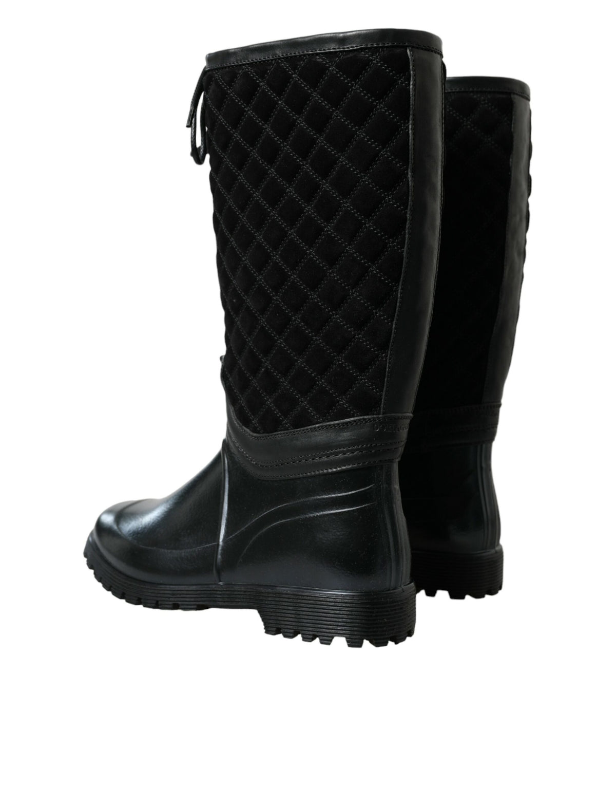 Indulge in the exquisite Dolce & Gabbana Black Chioggia Rain Boots, where luxurious calfskin and PVC meet timeless craftsmanship for a chic statement in any weather.