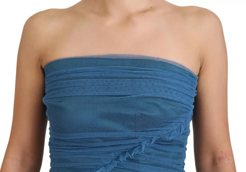 Indulge in the opulent allure of the Dolce & Gabbana Blue Mesh Trim Ruched Tulle Sheath Dress, a masterpiece of Italian craftsmanship that redefines elegance and sophistication.