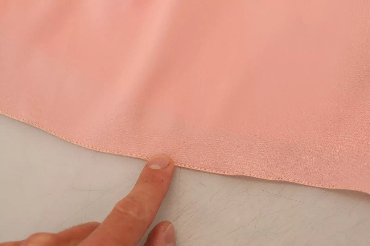 Experience the allure of the Dolce & Gabbana Pink Silk Stretch Strapless Sheath Midi Dress, a timeless embodiment of luxury and Italian craftsmanship designed for the discerning individual.