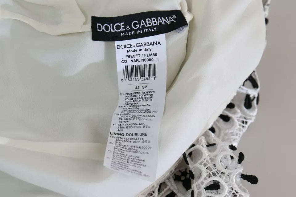 Elevate your wardrobe with the Dolce & Gabbana White Cutout Design A-line Midi Dress, a masterpiece of Italian craftsmanship and luxurious materials, perfect for any elegant occasion.