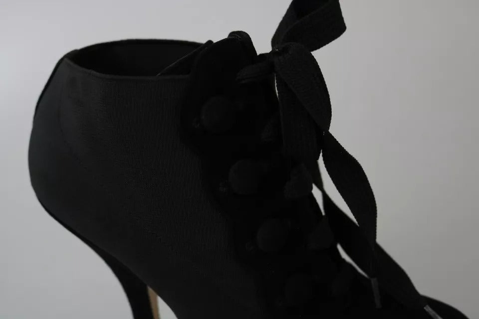 Indulge in the exquisite Dolce & Gabbana Black Suede Stretch Ankle Boots, where luxurious Capra suede meets refined Italian craftsmanship, elevating your every step with timeless elegance.