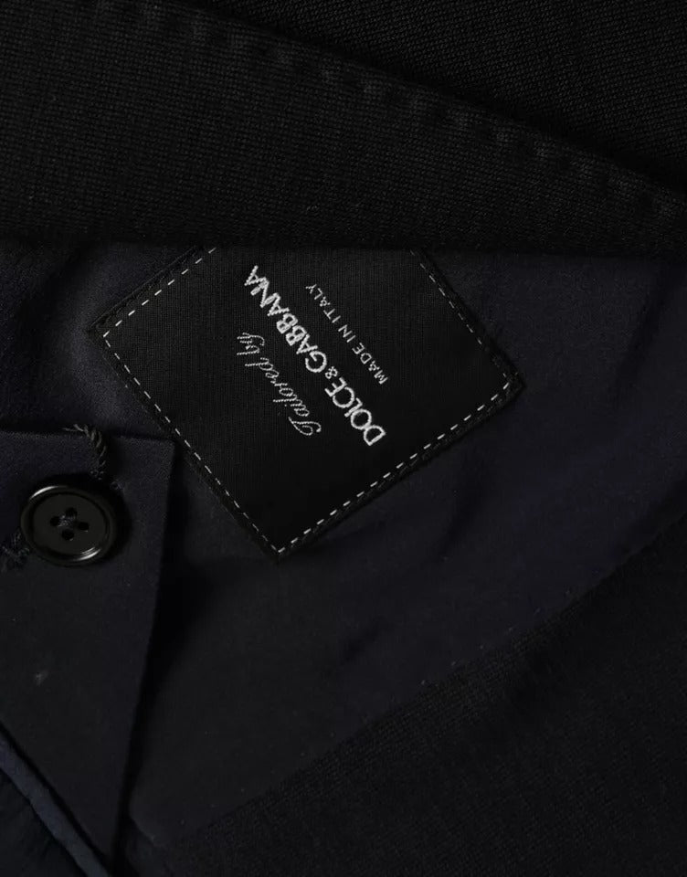Elevate your wardrobe with the Dolce & Gabbana Blue Wool Notch Single Breasted Coat Blazer, a masterpiece of Italian craftsmanship blending luxurious materials for timeless elegance.