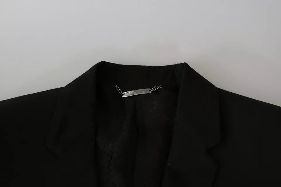 Discover the Dolce & Gabbana Black Wool Slim Fit Notch Jacket Blazer, a masterpiece of Italian craftsmanship that embodies timeless elegance and sophisticated allure.