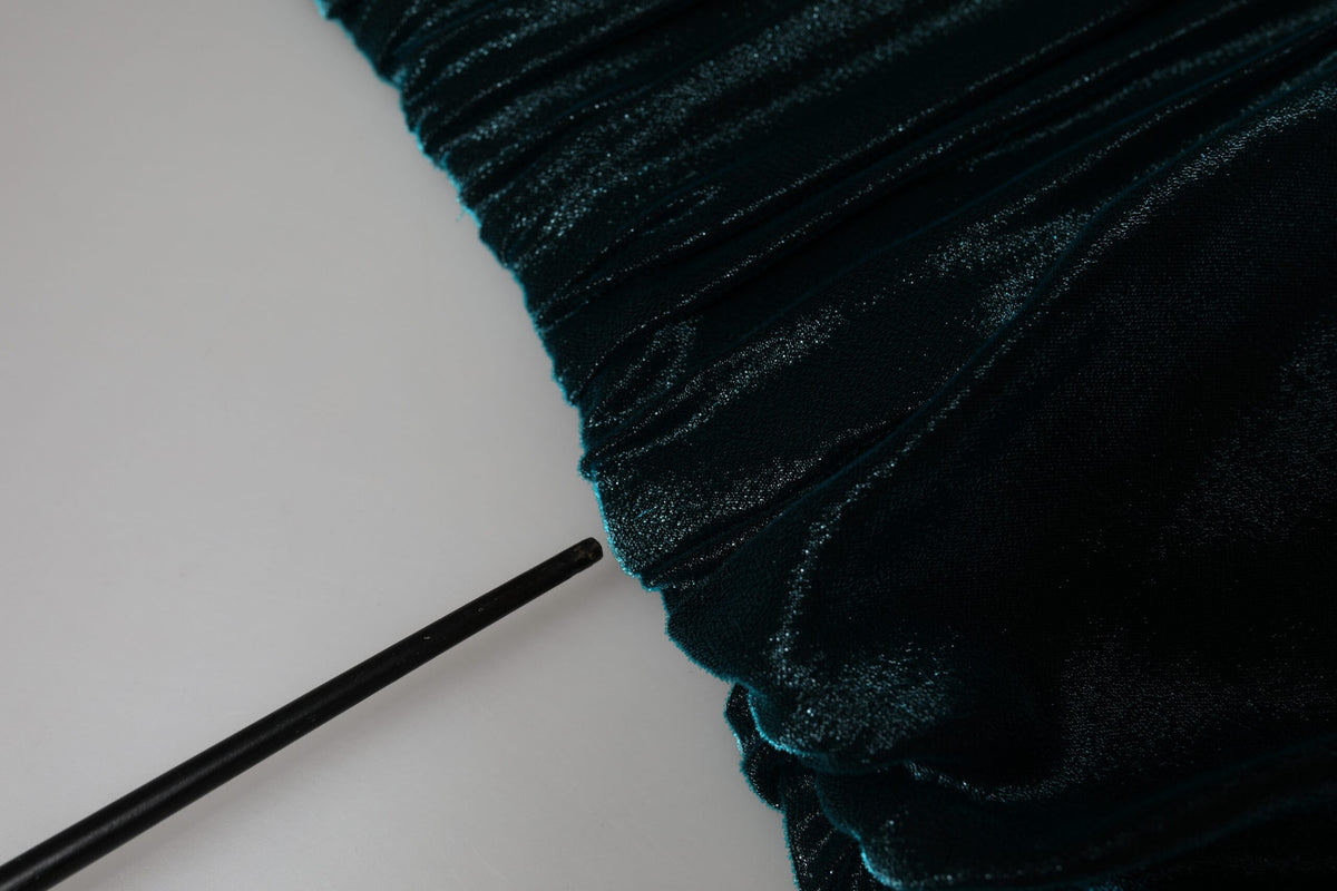 Discover the allure of the Dolce & Gabbana Green Silk Blend Satin Fitted Strapless Dress, a masterpiece of couture craftsmanship that embodies timeless elegance and sophistication.