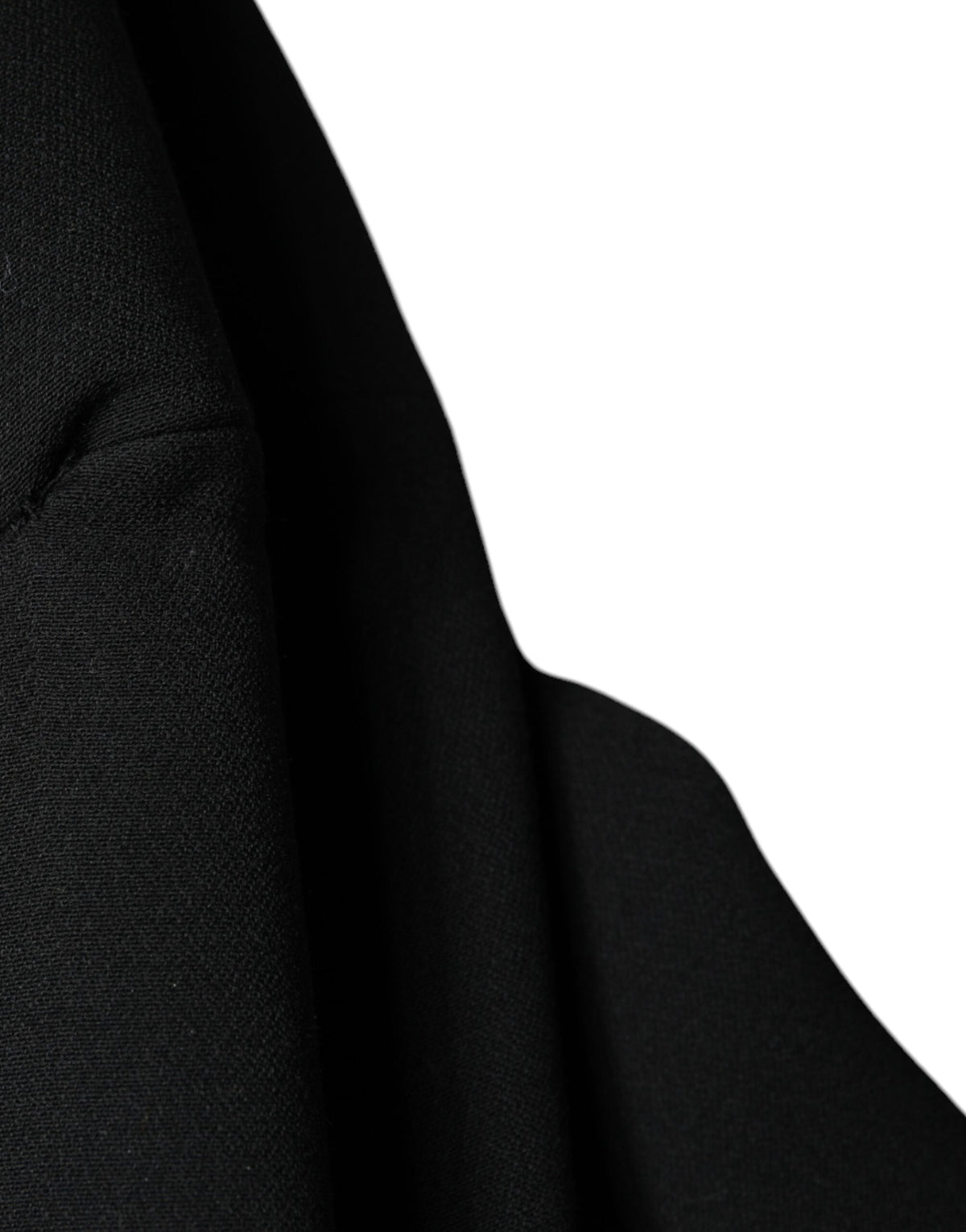 Discover the exquisite Dolce & Gabbana Black Double Breasted Trench Coat, a timeless statement of luxury crafted from virgin wool and silk, embodying sophistication and allure.