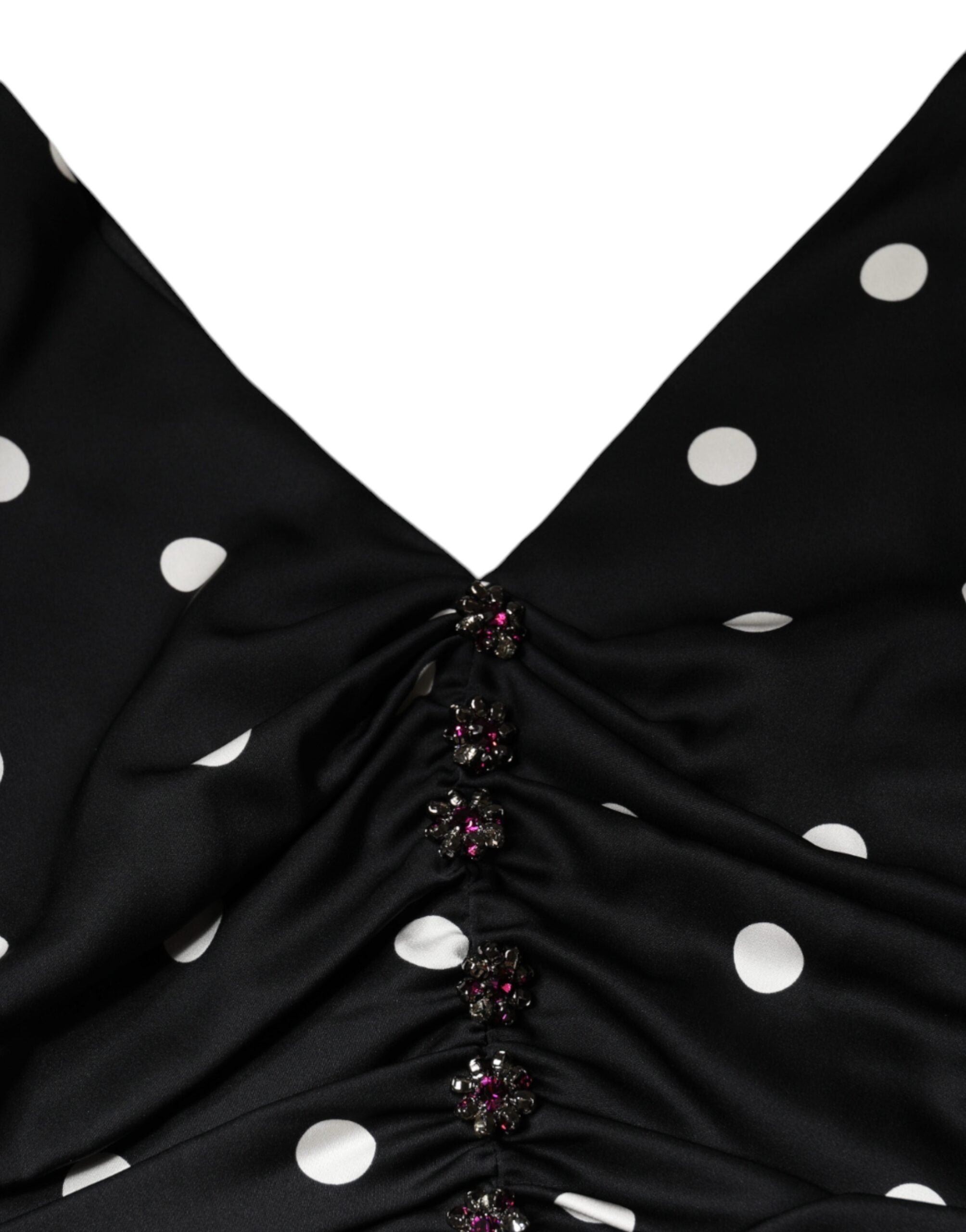 Indulge in the exquisite allure of the Dolce & Gabbana Black Silk Polka Dot Vneck Tassel Midi Dress, a timeless masterpiece crafted from luxurious silk, embodying sophistication and elegance.