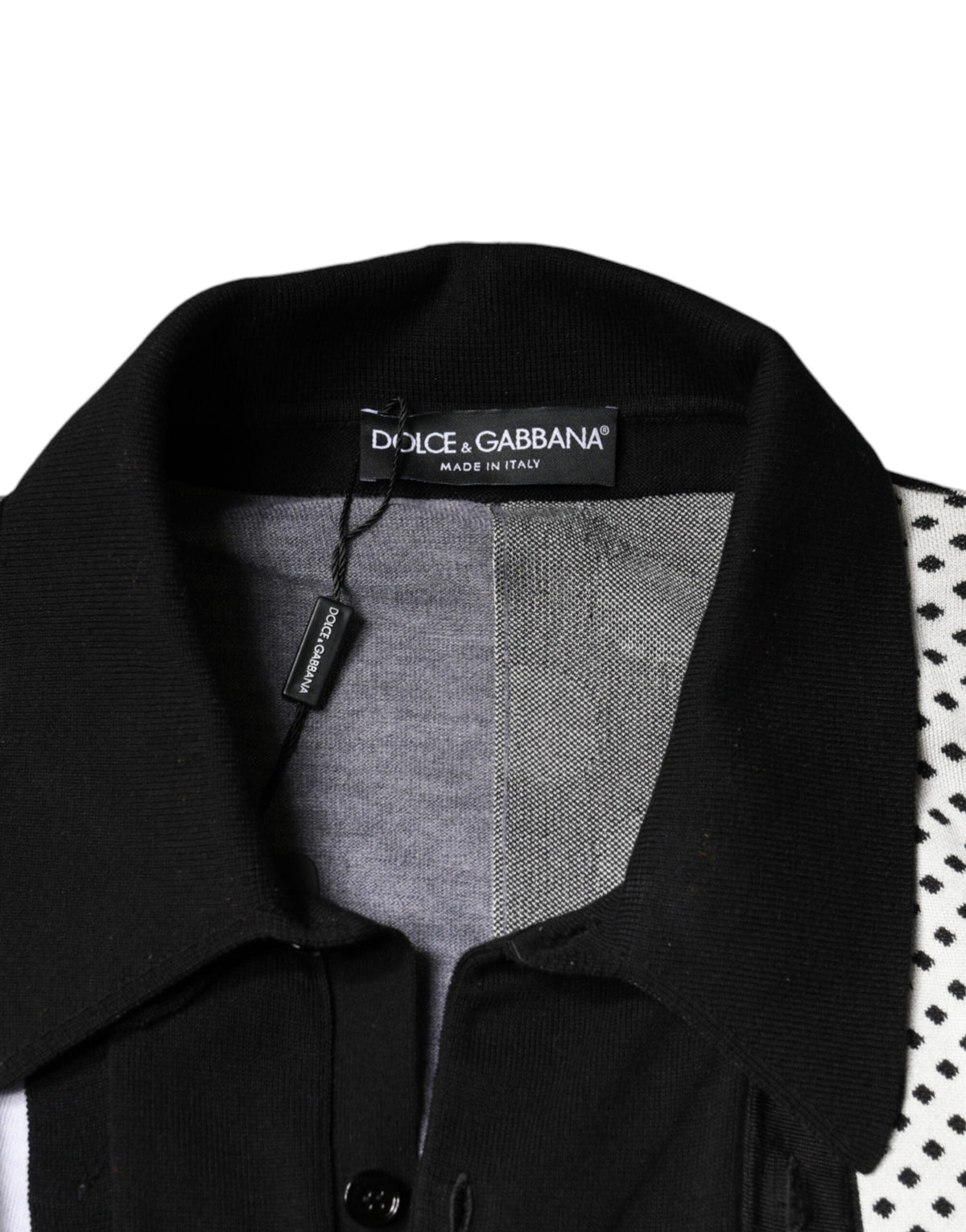 Elevate your wardrobe with the Dolce & Gabbana Black White Polka Dot Collared Polo T-shirt, a masterpiece of silk, cotton, and virgin wool, embodying timeless elegance and Italian artistry.
