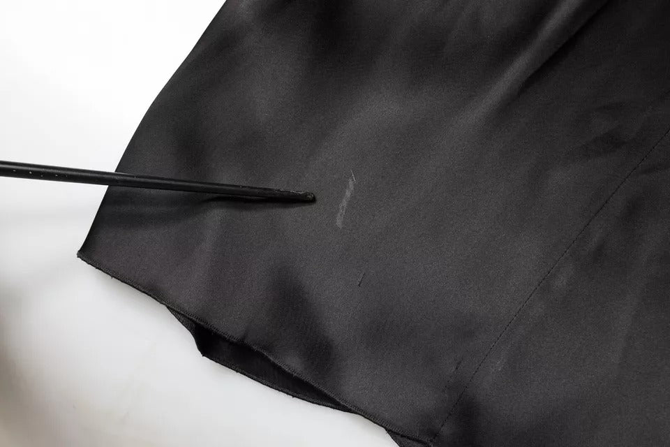 Experience the allure of the Emporio Armani Black Satin Long Sleeves Wrap Sheath Mini Dress, a masterpiece of Italian craftsmanship that embodies luxury and sophistication.