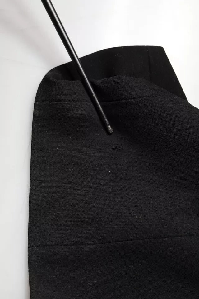 Indulge in the allure of the Emporio Armani Black Sleeveless Halter Sheath Long Gown, crafted in Italy from luxurious polyester, embodying timeless elegance and sophistication for unforgettable moments.