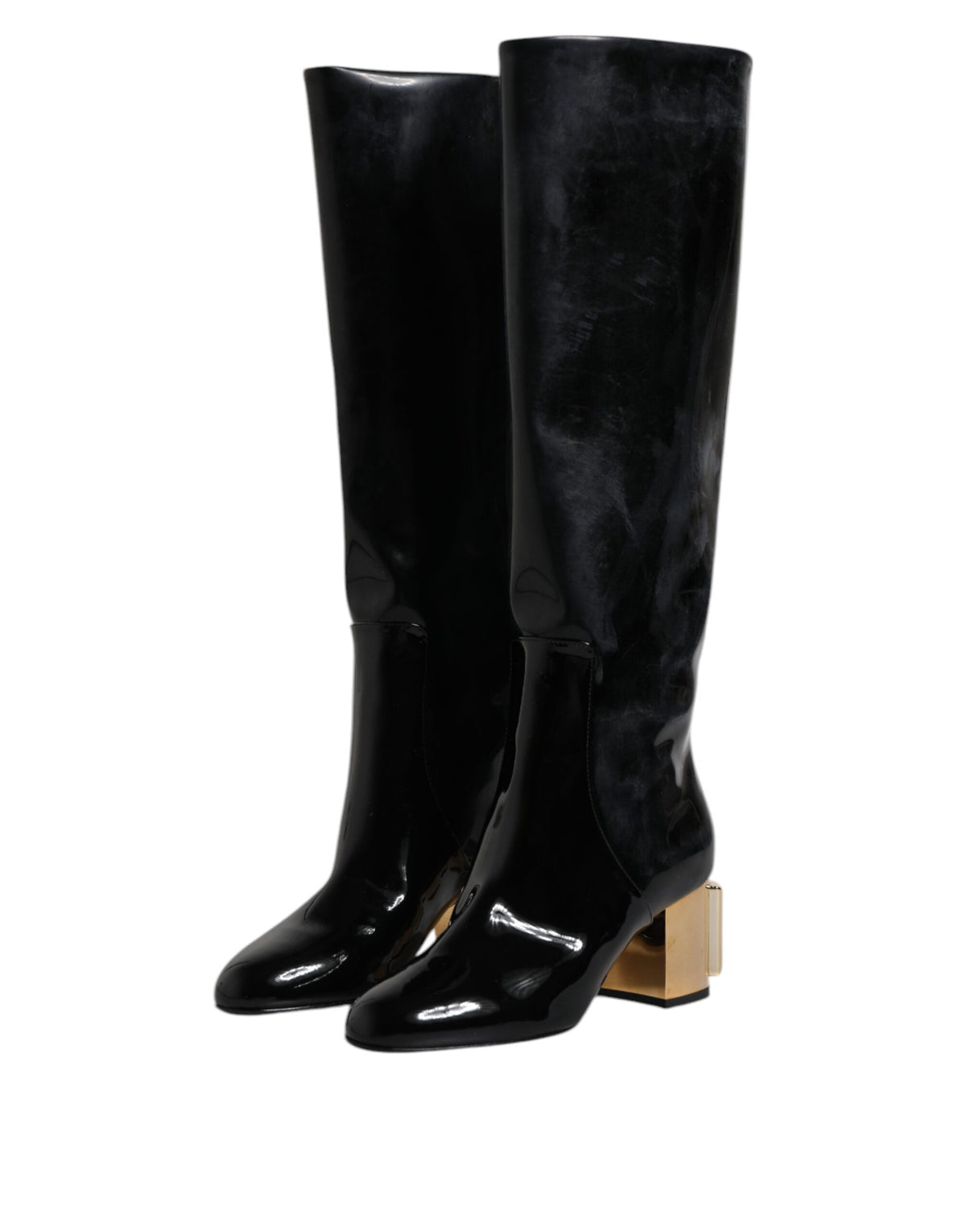 Indulge in the exquisite craftsmanship of Dolce & Gabbana's Black Patent Leather Vally High Boots, where opulent elegance meets timeless allure for the discerning individual.