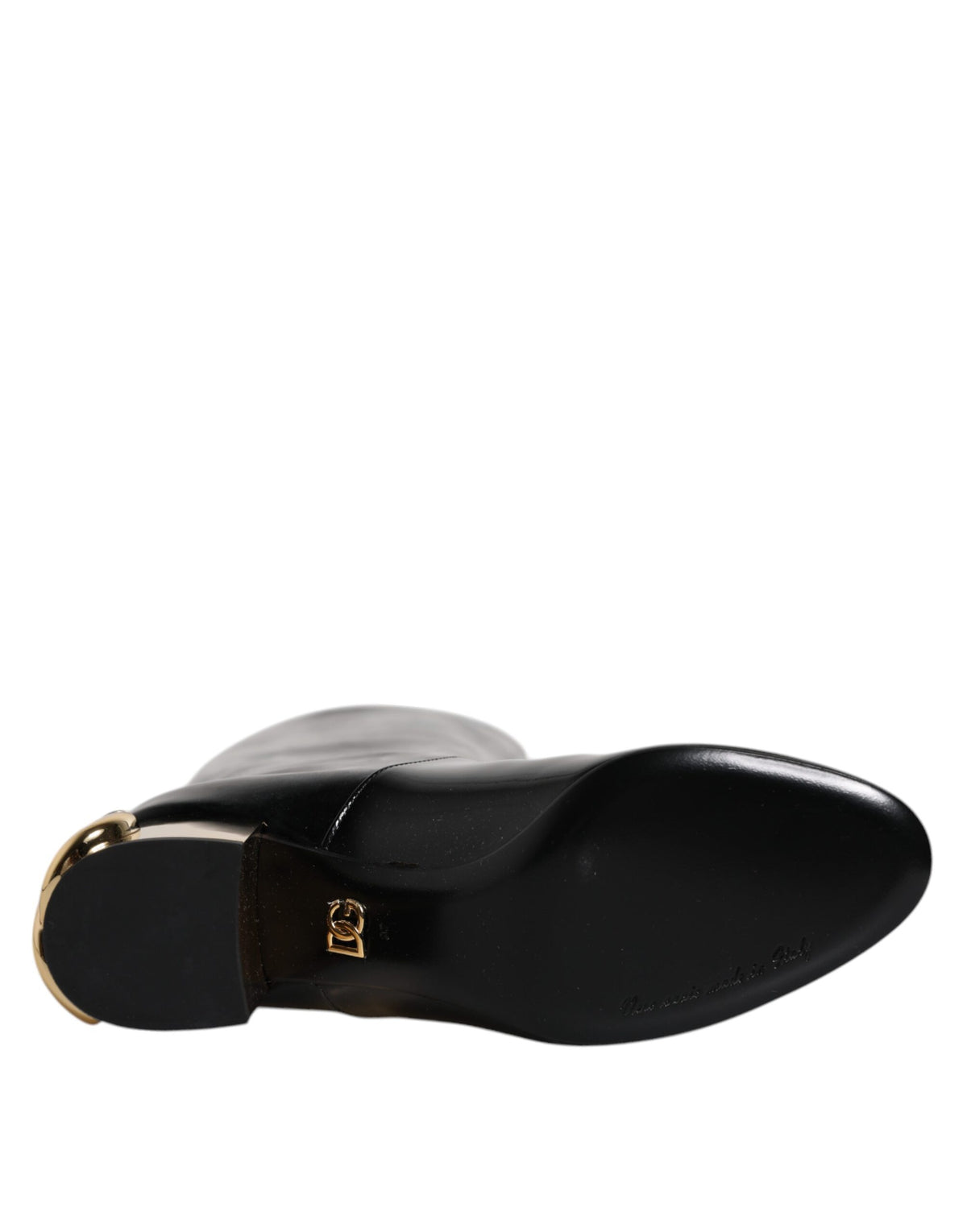 Experience the opulent allure of Dolce & Gabbana's Black Patent Leather Vally High Boots, where exquisite craftsmanship meets timeless elegance for the discerning individual.