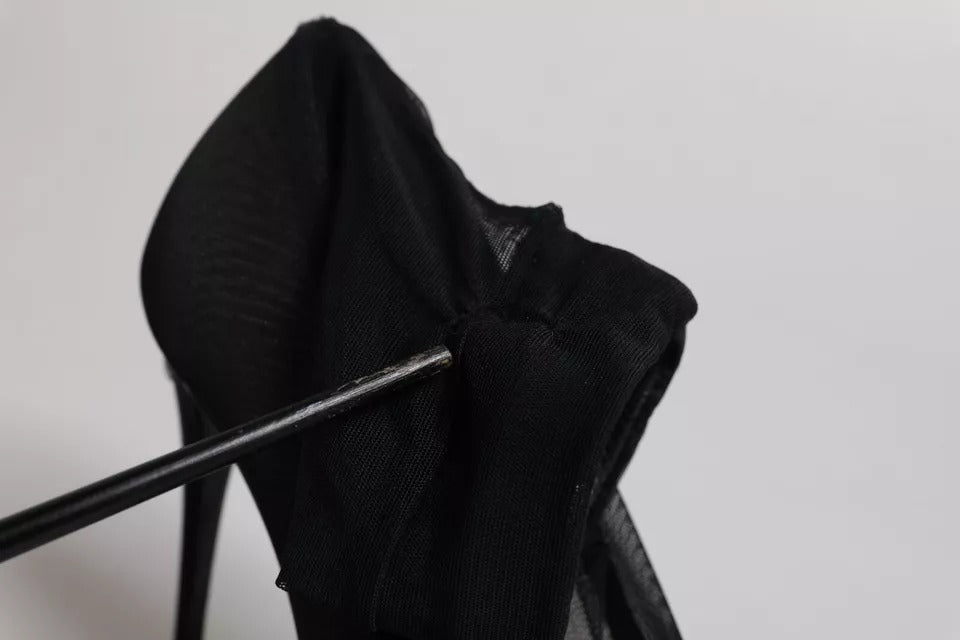 Experience the allure of Dolce & Gabbana's Black Viscose Mesh Sock Style Boots, where exquisite silk and viscose craftsmanship redefine luxury footwear for the discerning individual.