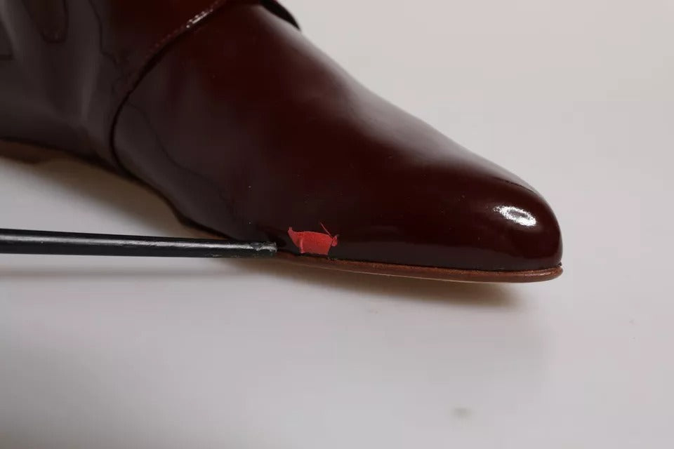 Step into a realm of elegance with Dolce & Gabbana's Maroon Leather Lace Up Ankle Boots, where exquisite craftsmanship meets timeless allure, perfect for the discerning individual.