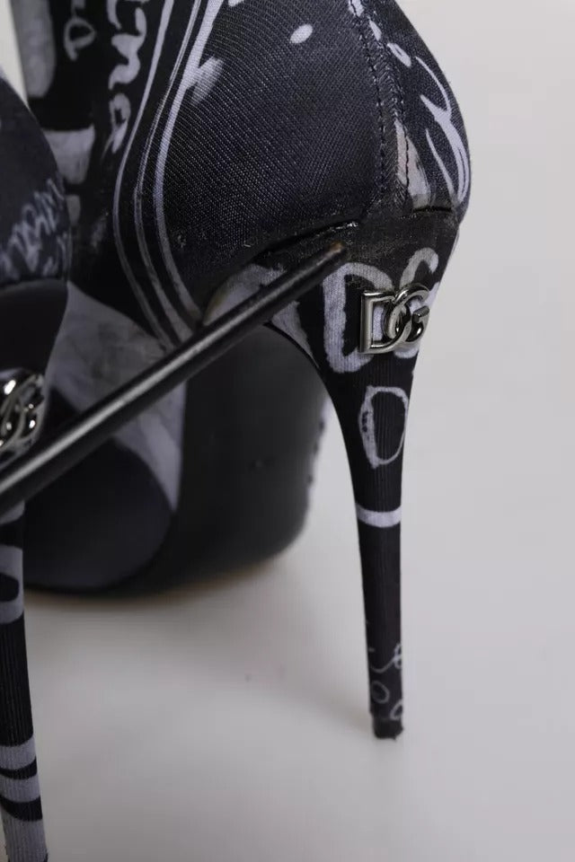 Step into unparalleled elegance with Dolce & Gabbana's Black Logo Stretch Heels High Boots, crafted in Italy from luxurious materials for the confident individual.