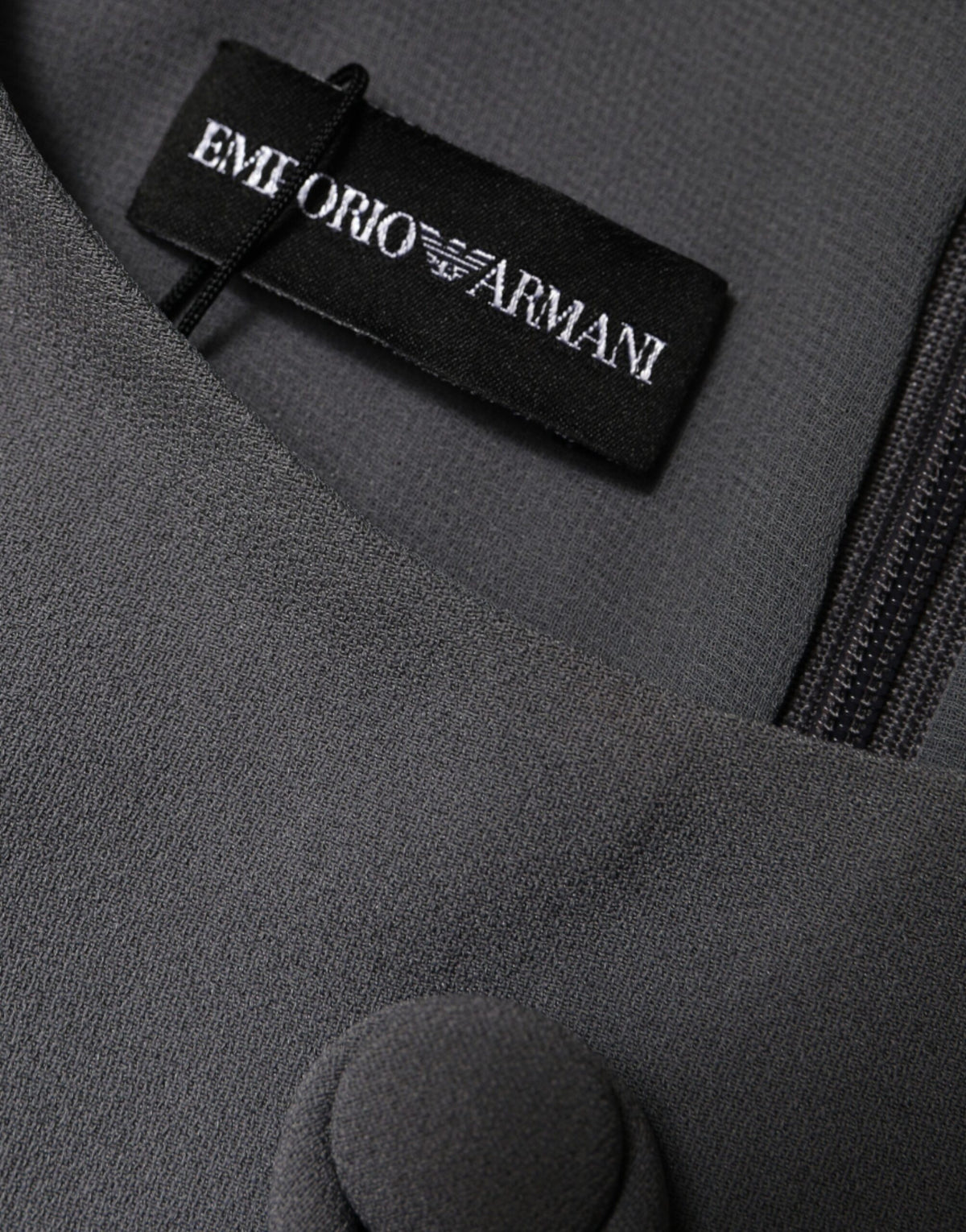 Elevate your wardrobe with the Emporio Armani Gray Round Neck Sleeveless A-line Mini Dress, a masterpiece of Italian craftsmanship in luxurious acetate and viscose.