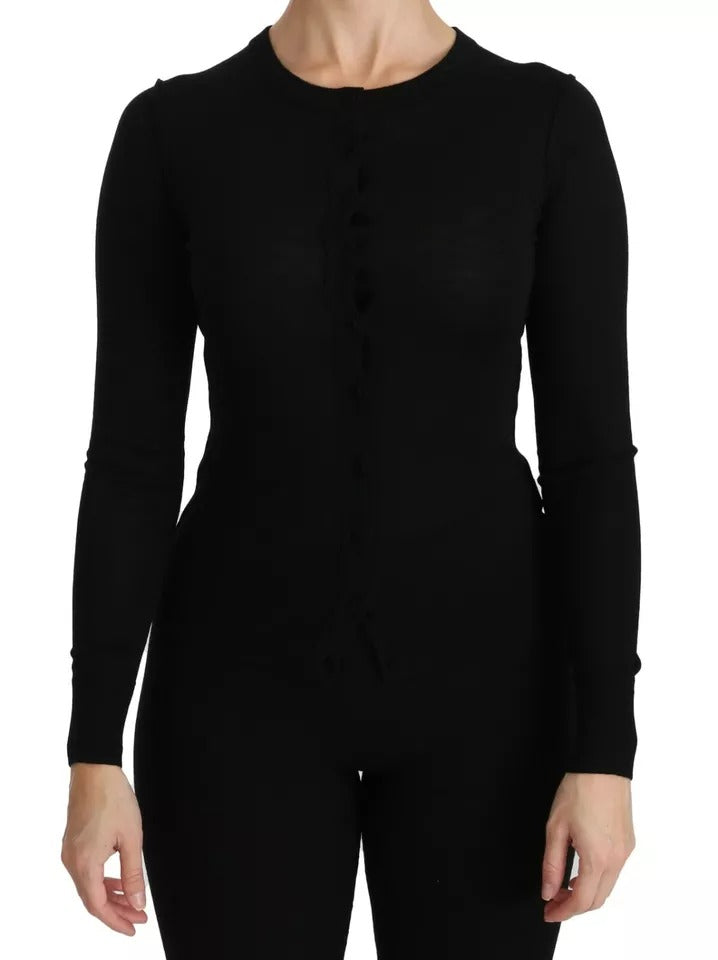 Elevate your wardrobe with the Dolce & Gabbana Black Virgin Wool Long Sleeve Top, a masterpiece of Italian craftsmanship that embodies luxurious elegance and timeless allure.